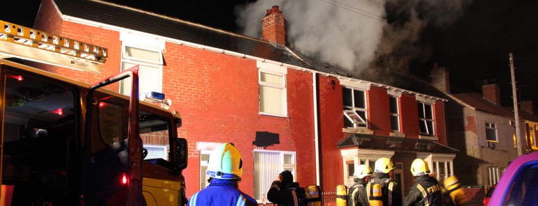 Firefighters tackling a house fire in Rotherham