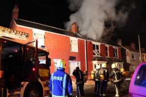 Firefighters tackling a house fire in Rotherham
