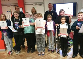 Youth club participants pick up certificates at the fire service training centre
